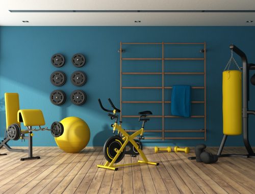 Blue home gym with black and yellow fitness equipment